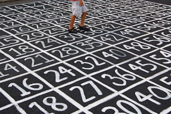 Person walking over a numbered grid with lots of cells.